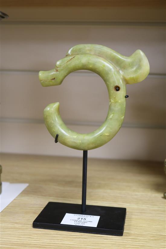 A Chinese yellow carved stone pendant